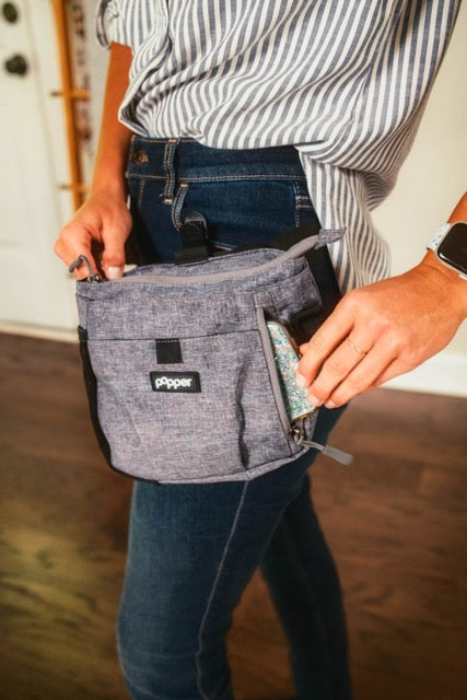 Women wearing a dog training treat pouch